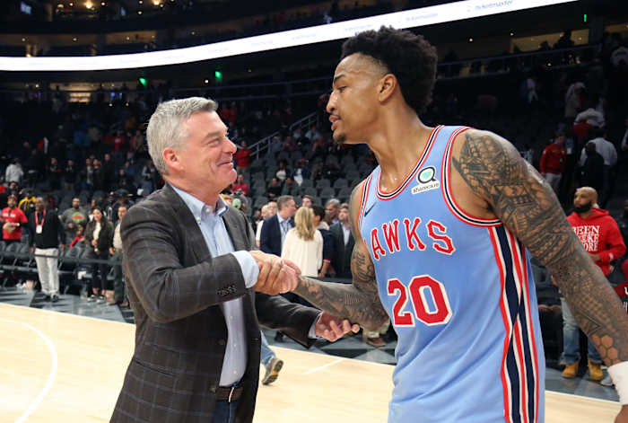 Atlanta Hawks owner owner Antony Ressler greets Atlanta Hawks forward John Collins (20) after a game against the Houston Rockets at State Farm Arena.